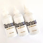Three Charcoal Facial Cleanser 3.4 oz bottles, angled